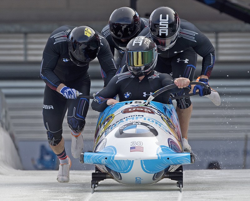 In this March 7, 2015, file photo, driver Codie Bascue, front, and his United States team, push off at the start during the first run of the four-man bobsled competition at the Bobsled and Skeleton World Championships in Winterberg, Germany. Drivers Justin Olsen, Nick Cunningham, Codie Bascue will lead the U.S. Olympic bobsled team. 