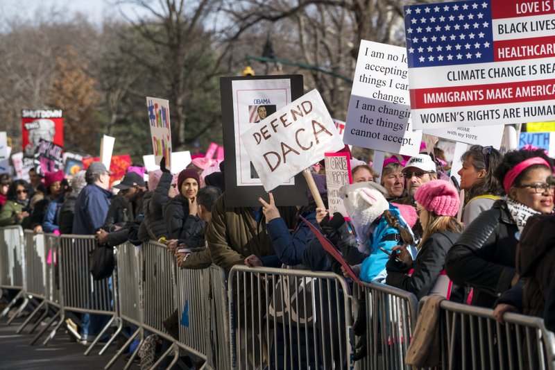 People line up on Central Park West as they wait for the start of a march highlighting equal rights and equality for women Saturday, Jan. 20, 2018, in New York. The New York protest was among more than 200 such actions planned for the weekend around the world. (AP Photo/Craig Ruttle)