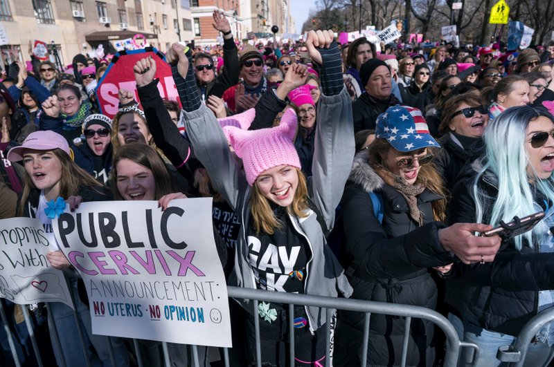 People cheer as they listen to a speaker as they take part in a march highlighting equal rights and equality for women Saturday, Jan. 20, 2018, in New York. The New York protest was among more than 200 such actions planned for the weekend around the world. 