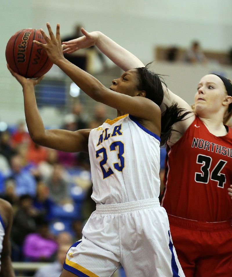 North Little Rock’s Kennady Tucker (23) puts up a shot as Fort Smith Northside’s Tracey Bershers defends during the fourth overtime of North Little Rock’s 80-75, five-overtime victory Friday night.