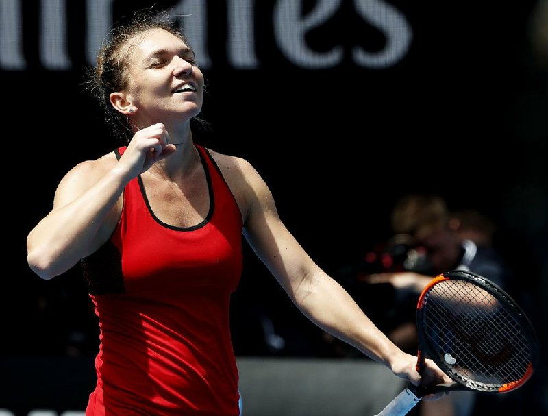 Romania’s Simona Halep celebrates after defeating the United States’ Lauren Davis in their third-round match early today at the Australian Open in Melbourne, Australia.