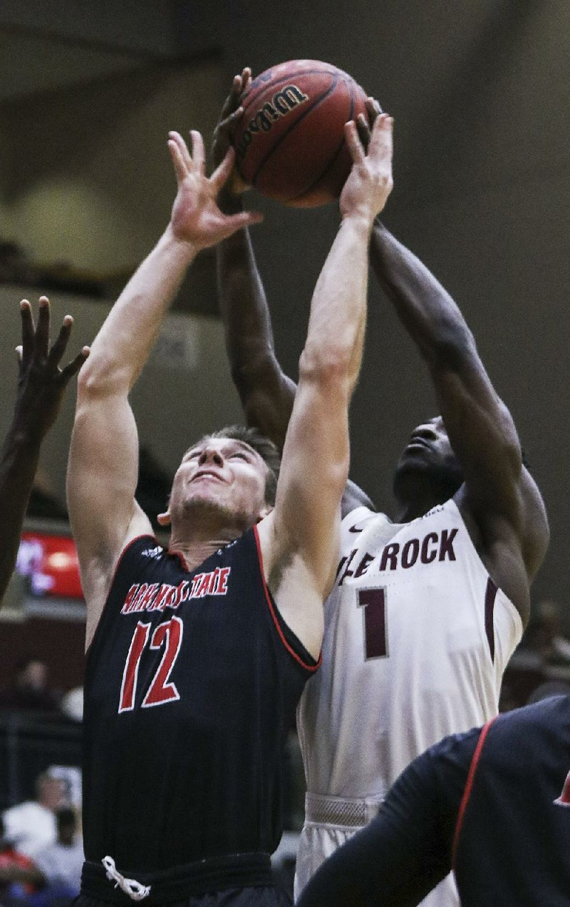 Arkansas State’s Connor Kern (12) finished with 8 points in the Red Wolves’ 70-62 victory over UALR, while Andre Jones had 11 points and 9 rebounds for UALR.