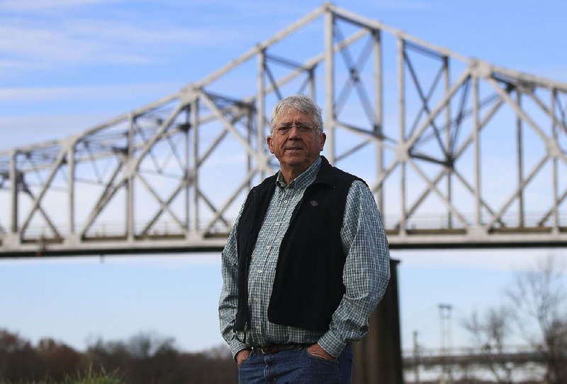 Clarendon Mayor Jim Stinson III stands in front of the nearly 87-year-old bridge that until a couple of years ago bore U.S. 79 traffic through the lush wildlife refuges of the White and Cache rivers.