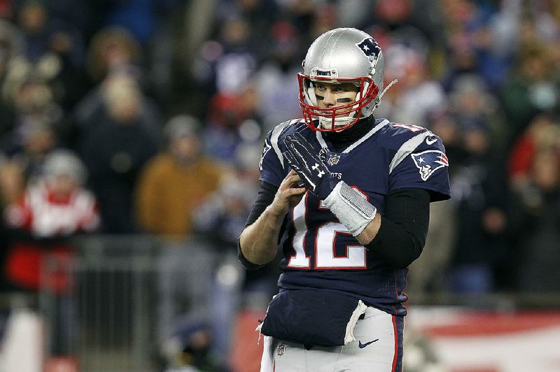 New England Patriots quarterback Tom Brady, who has never missed a playoff start during his 18-year career, is listed as questionable for today’s game against the Jacksonville Jaguars after injuring his right hand Wednesday in practice.