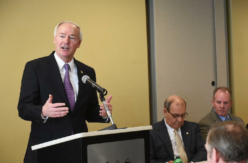 Gov. Asa Hutchinson delivers remarks Tuesday Jan. 16 2018 at the North American Free Trade Agreement summit in Rogers.