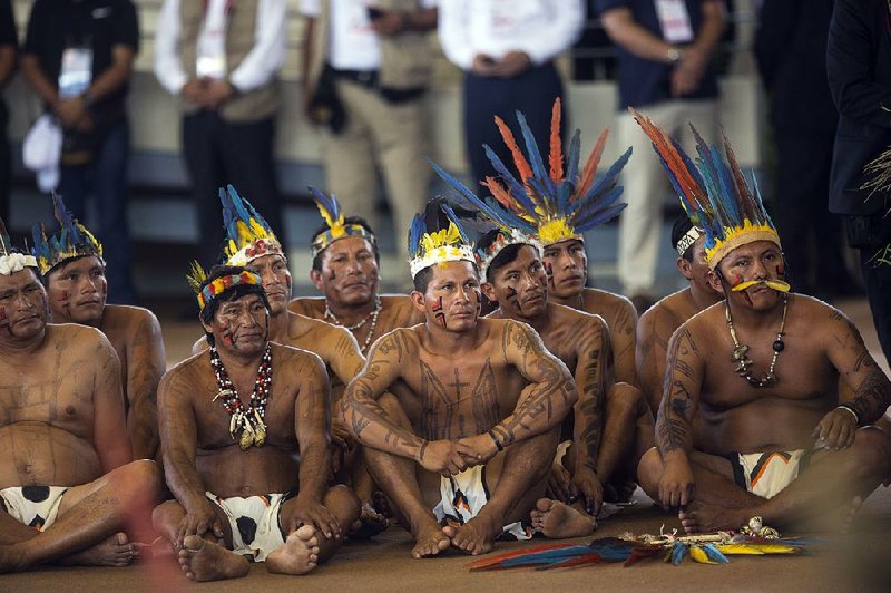 Representatives of Peru’s indigenous peoples attend a speech by Pope Francis on Friday in Puerto Maldonado in which the pope called the natives the custodians of “our common home.”