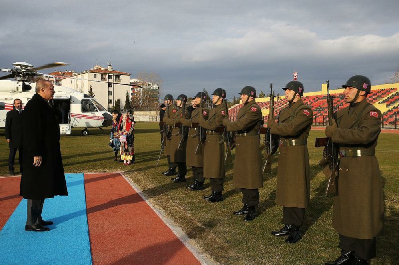 Turkish President Recep Tayyip Erdogan inspects a military honor guard Saturday during a stop in the western city of Usak.