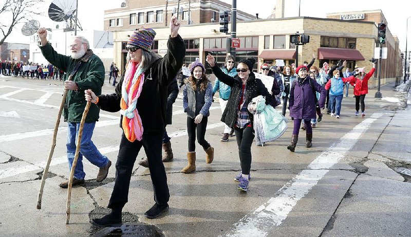People participate Saturday in the Women’s March in Green Bay, Wis.