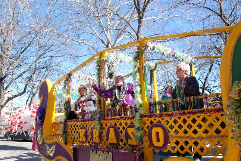 Courtesy Photo The Krewe of Krazo tosses beads from their float during a previous parade.