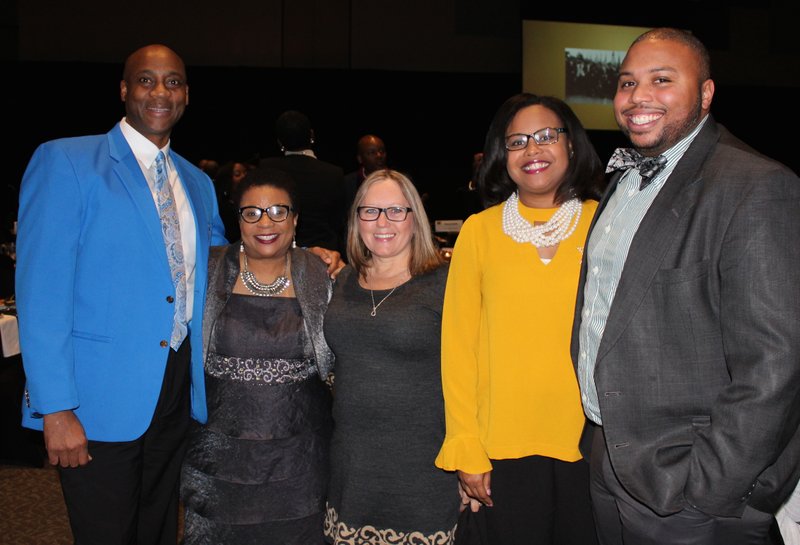 NWA Democrat-Gazette/CARIN SCHOPPMEYER Henry Smith (from left), Angela Mosley-Monts, Dawn James, Javannah Hinton and Todd Jenkins gather at the 22nd annual Dr. Martin Luther King Jr. Recommitment Banquet on Monday evening at the Fayetteville Town Center.