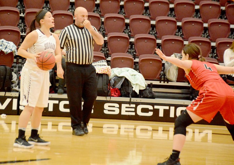 Graham Thomas/Siloam Sunday Siloam Springs senior Morgan Vaughn calls out a play in the first half Tuesday as Russellville's Mickey Belle Shields defends.