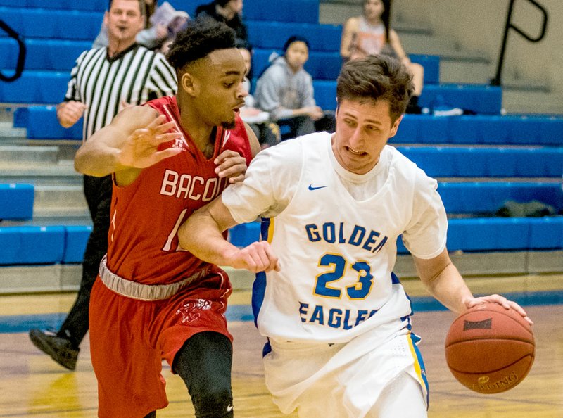 Photo courtesy of JBU Sports Information John Brown's Rokas Grabliauskas drives to the basket against Bacone on Tuesday in the Golden Eagles' 100-91 overtime victory.
