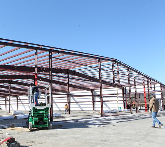 Construction crews work on the new Morfe Manufacturing window plant in Mountain Pine Wednesday, January 17, 2018. (The Sentinel-Record/Richard Rasmussen)