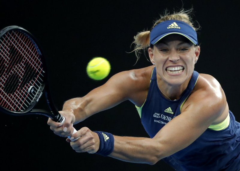 Germany's Angelique Kerber hits a backhand return to Russia's Maria Sharapova during their third round match at the Australian Open tennis championships in Melbourne, Australia, Saturday, Jan. 20, 2018. (AP Photo/Vincent Thian)