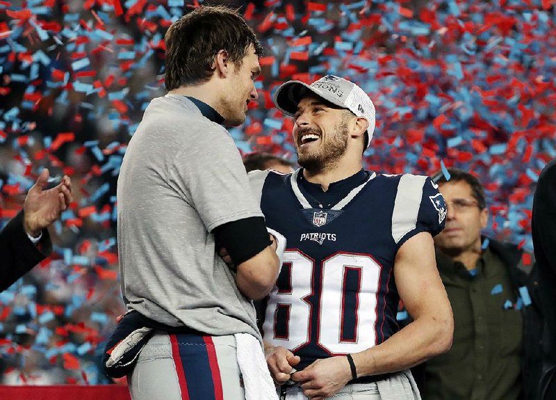 Quarterback Tom Brady (left) and wide receiver Danny Amendola celebrate the New England Patriots winning the AFC championship on Sunday after a 24-20 victory over the Jacksonville Jaguars in Foxborough, Mass. Amendola caught a 4-yard pass from Brady with 2:48 left in the game to give the Patriots their first lead.