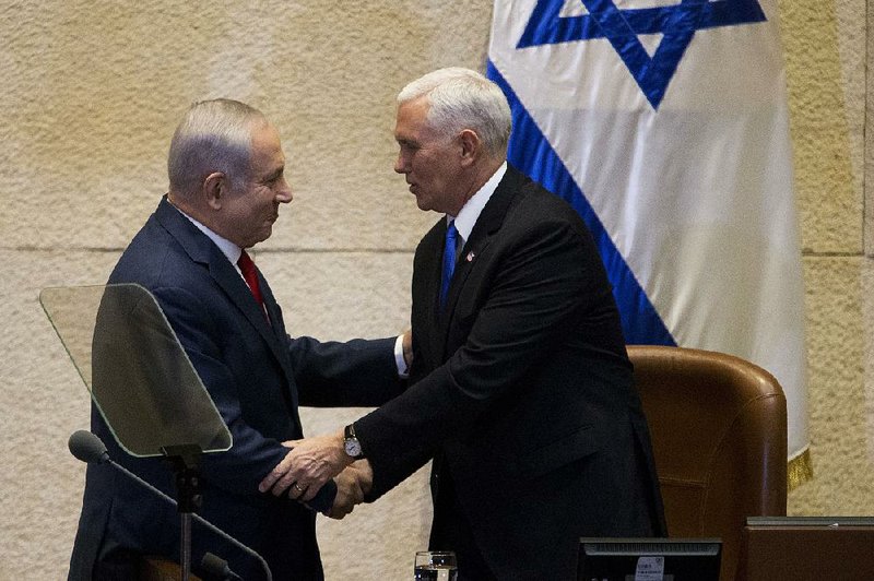 Israel’s Prime Minister Benjamin Netanyahu (left) greets U.S. Vice President Mike Pence in Israel’s parliament in Jerusalem on Monday.