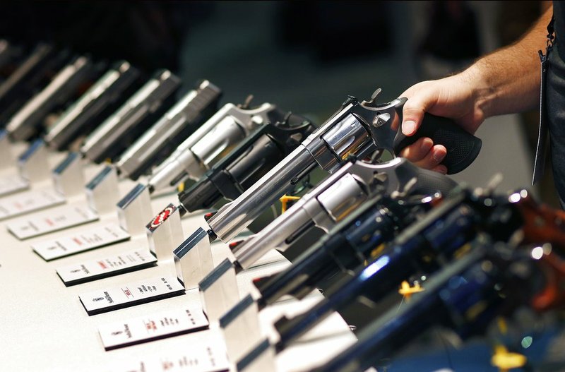 AP File Photo/John Locher In this Jan. 19, 2016 file photo, handguns are displayed at the Smith &amp; Wesson booth at the Shooting, Hunting and Outdoor Trade Show in Las Vegas. The largest gun industry trade show will be taking place in Las Vegas Jan. 23-26 just a few miles from where a gunman carried out the deadliest mass shooting in modern U.S. history.