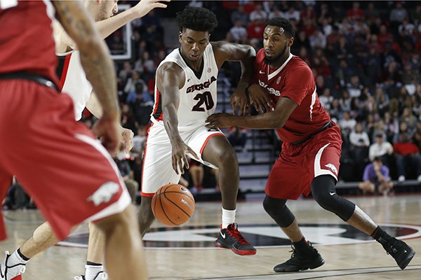 Georgia forward Rayshaun Hammonds (20) moves the ball down the court during the first half of the team's NCAA college basketball game against Arkansas in Athens, Ga., Tuesday, Jan. 23, 2018. (Joshua L. Jones/Athens Banner-Herald via AP)

