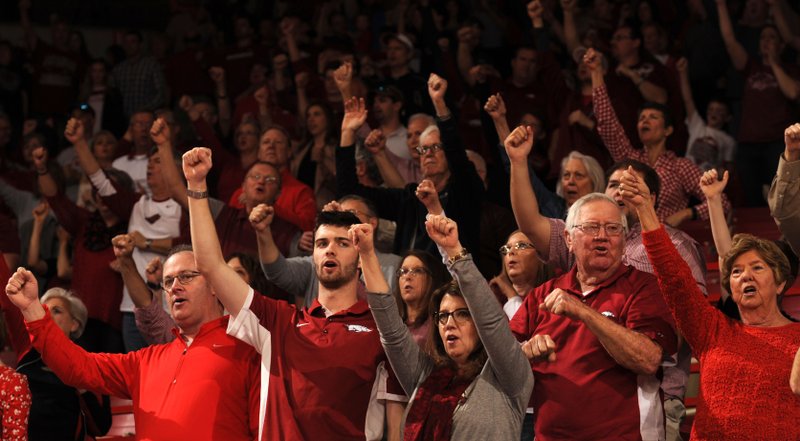 Arkansas fans celebrate during the first half of the Razorbacks' 85-67 win against Georgia on March 4, 2017, in Bud Walton Arena in Fayetteville.