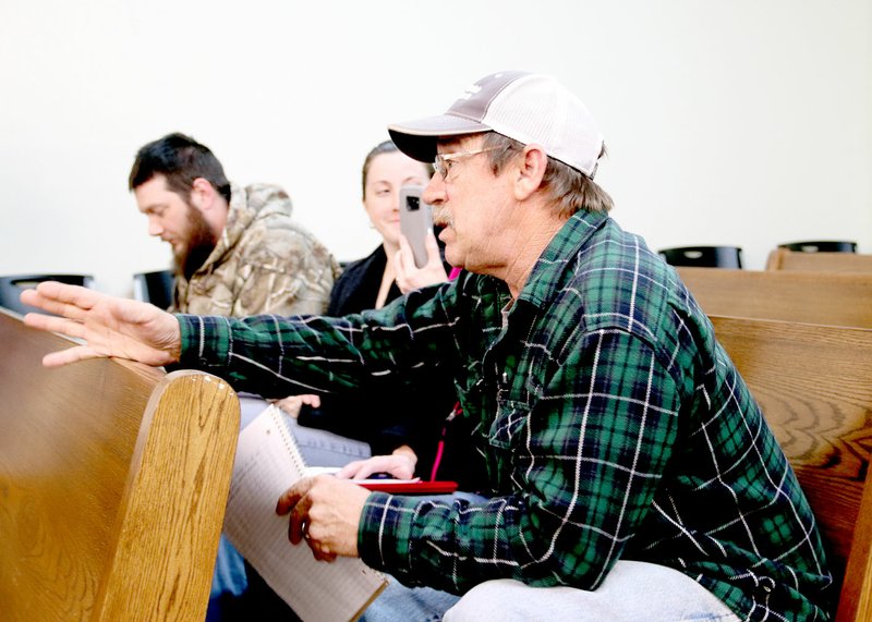 LYNN KUTTER ENTERPRISE-LEADER David Ruff of Prairie Grove asks questions about water quality issues at the Jan. 15 City Council meeting.