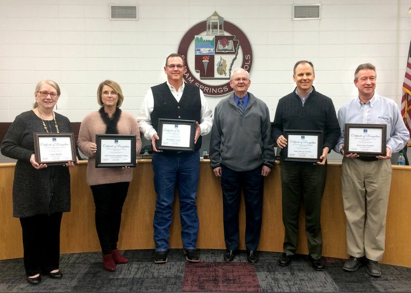 Janelle Jessen/Siloam Sunday Superintendent Ken Ramey honored school board members as part of school board appreciation month during Tuesday's meeting. Ramey read a proclamation from Gov. Asa Hutchinson and a resolution from the Arkansas State Board of Education thanking school board members for their service. Pictured, from left, are school board members Connie Matchell, Audra Farrell and Brent Butler, Ramey, and school board members Roger Holroyd and Brian Lamb.