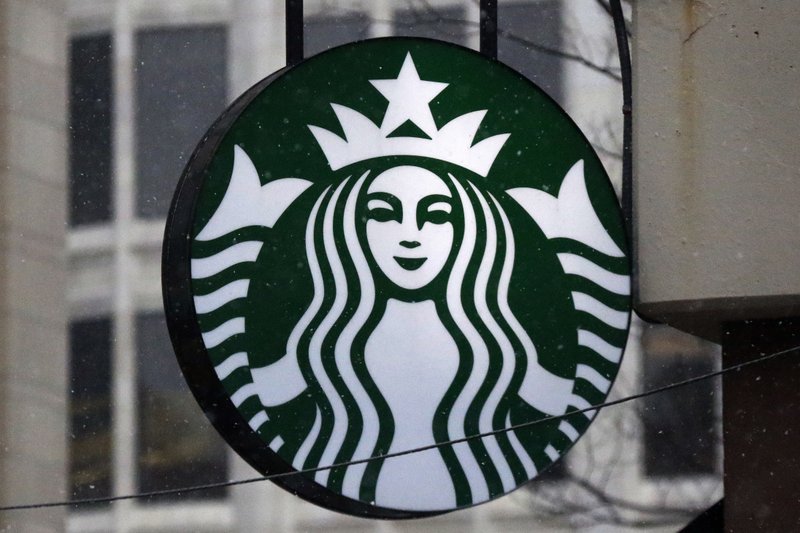 FILE - This Tuesday, March 14, 2017, file photo shows the Starbucks logo on a shop in downtown Pittsburgh. (AP Photo/Gene J. Puskar, File)


