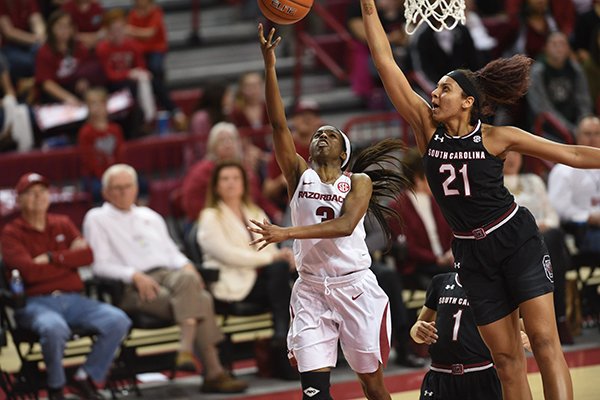 Arkansas' Malica Monk shoots over South Carolina's Mikiah Herbert Harrigan during a game Sunday, Feb. 5, 2017, in Fayetteville. 