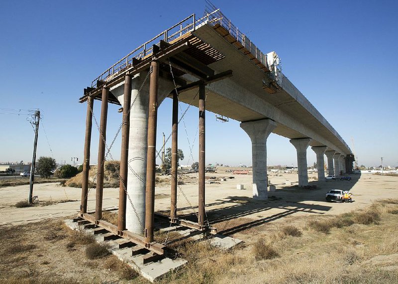 An elevated section of the high-speed rail project awaits further construction in Fresno, Calif., last month. Officials have raised the projected cost of the first phase of California’s bullet train project from about $6 billion to $10.6 billion. 