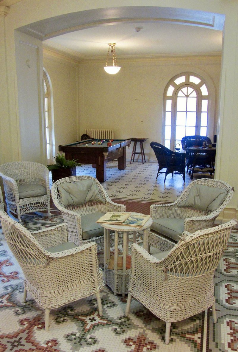 The Music Room (foreground) and the Men’s Lounge at the restored Fordyce Bathhouse in Hot Springs feature the building’s stylish fittings. 
