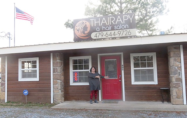 WESTSIDE EAGLE OBSERVER/Susan Holland Hilarie Dodd, owner of the Thairapy hair salon, welcomes visitors to her new location just south of the Hillcrest Cemetery in Gravette. Business hours are 10 a.m. to 6 p.m. Monday through Friday and 9 a.m. to 2 p.m. Saturday. Dodd has planned an open house for Saturday, Feb. 10.