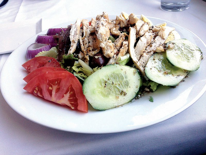 The Athenian salad, served here with grilled chicken, contains Romaine, tomato, cucumber, red onion, kalamata olives, boiled eggs, feta and anchovies at The Terrace Mediterranean Kitchen in Little Rock. 