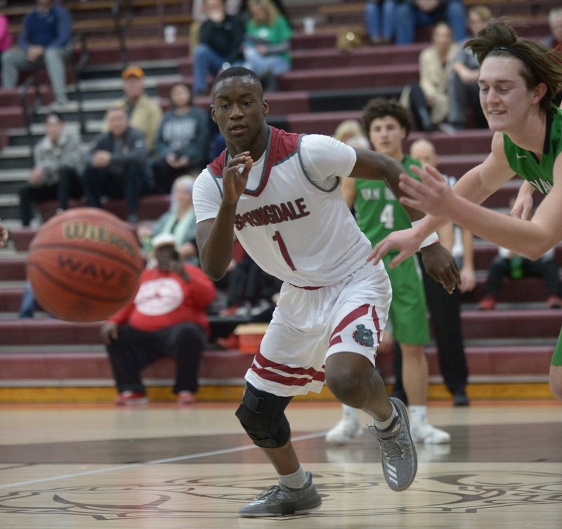 NWA Democrat-Gazette/ANDY SHUPE Springdale High's Jajuan Boyd (1) and Van Buren's Gavin Ball reach for a loose ball Friday, Jan. 19, 2018, during the first half in Bulldog Gymnasium in Springdale. The Bulldogs earned a huge road win Tuesday at Fayetteville and will host Rogers High tonight in 7A-West Conference action.