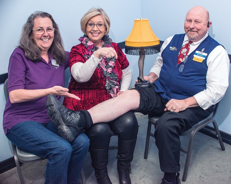 The Malvern Area Kiwanis Club will sponsor its annual chili supper and sexy-legs contest Saturday at the Malvern Boys & Girls Club. Kiwanians Susan Lafond, left, and Terri Bryant ham it up for the camera, along with Benny Hardage, manager of the Malvern Walmart Supercenter, who won the sexy-legs contest last year.