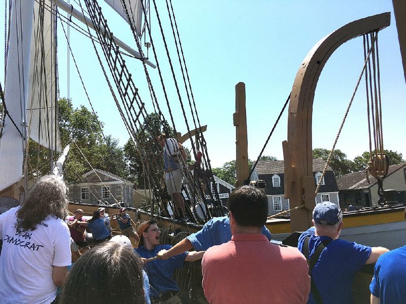 Mystic Seaport visitors pitch in to help staff members haul up a whaleboat on the Charles W. Morgan, a 19th-century wooden whaleship that’s a spiritual twin to Moby-Dick’s fictional Pequod. The ship hosts marathon Moby-Dick readings every year.