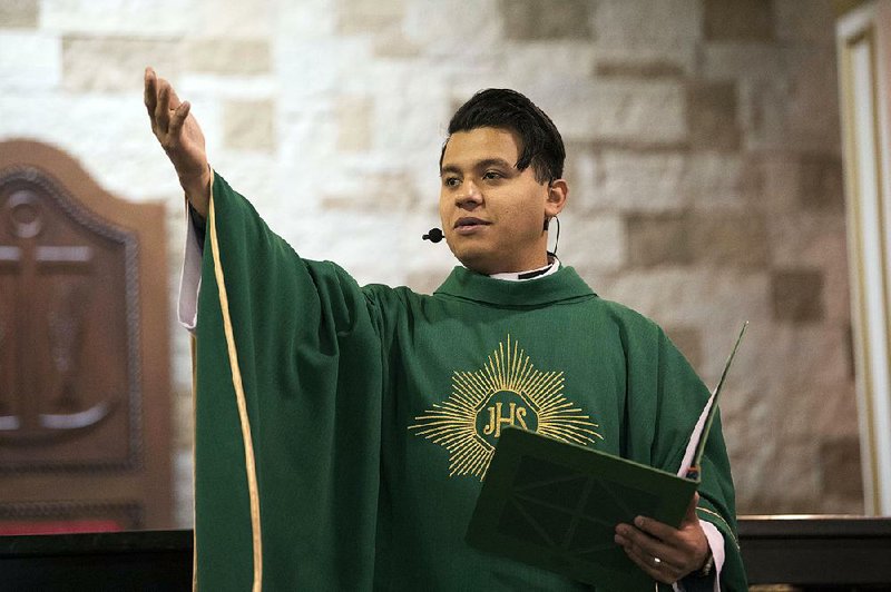 The Rev. Rey Pineda celebrates Mass at Mision Catolica de Cristo Rey in Atlanta.