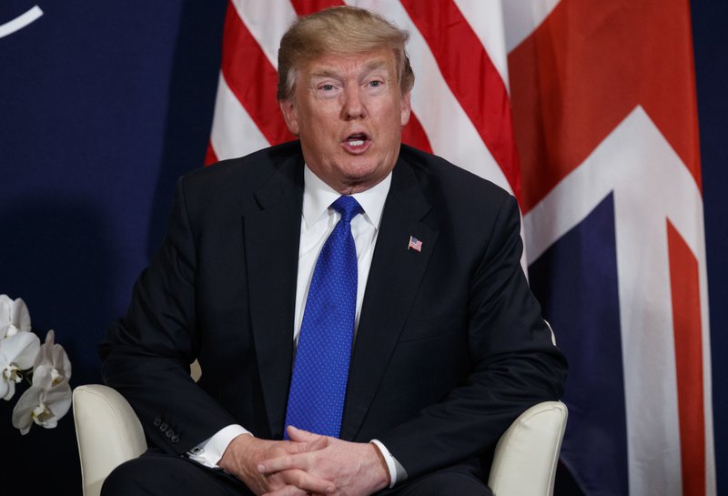 In this Jan. 25, 2018, photo, President Donald Trump speaks at the World Economic Forum in Davos. Trump's loyalists are lashing out against his proposal to give path to citizenship for nearly 2 million "Dreamer" immigrants. (AP Photo/Evan Vucci)