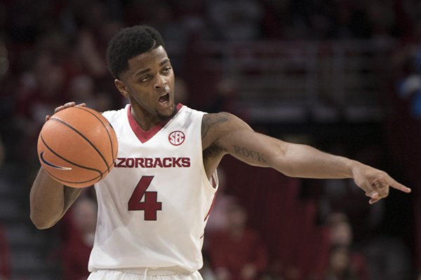 Arkansas guard Daryl Macon dribbles during a game against Oklahoma State on Saturday, Jan. 27, 2018, in Fayetteville. 