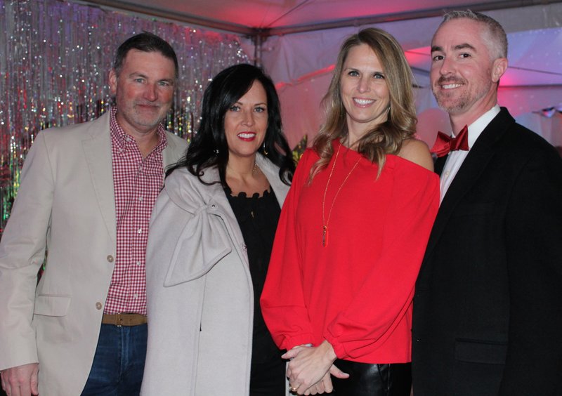 Scott and Jessica Bolle (from left) and Holly and Matt Hicks Paint the Town Red with the American Heart Association on Jan. 19 at the Fayetteville Town Center.