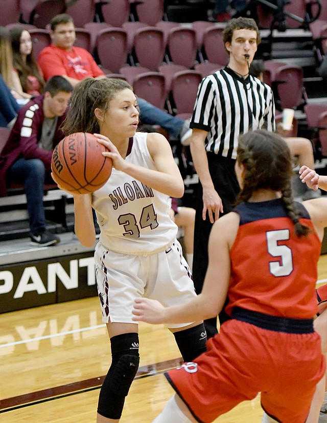 Bud Sullins/Special to Siloam Sunday Siloam Springs senior Kirsten Williams-Loftis looks for a pass Tuesday against Providence Academy.