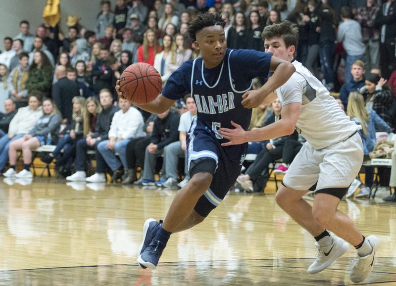 NWA Democrat-Gazette/CHARLIE KAIJO Springdale Har-Ber junior guard Tylor Perry (5) dribbles past a Bentonville High defender during a basketball game on Friday, January 12, 2018 at Tiger Arena. Perry leads the 7A-West in scoring at 22 points per game.