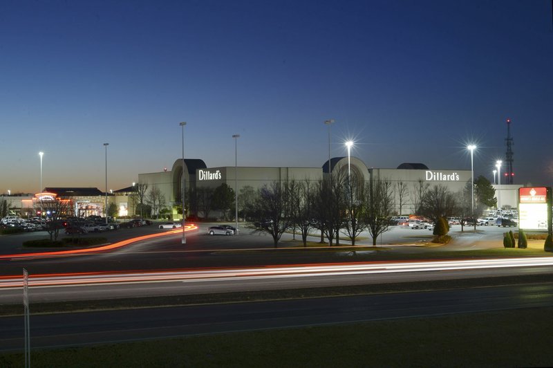 NWA Democrat-Gazette/ANDY SHUPE Traffic passes Thursday along College Avenue past the Northwest Arkansas Mall in Fayetteville. Owners of the mall have sued the county claiming the property is overvalued and they should pay less in county taxes.