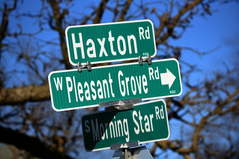 NWA Democrat-Gazette/FLIP PUTTHOFF Signs are seen Wednesday at the junction of Morning Star and Haxton roads southwest of Bentonville.