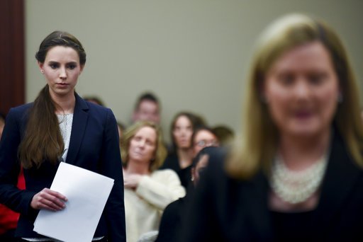 Rachael Denhollander, left, is introduced by Assistant Attorney General Angela Povaliatis, before she makes the final victim impact statement, during Larry Nassar's sentencing hearing Wednesday, Jan. 24, 2018 in Lansing, Mich.