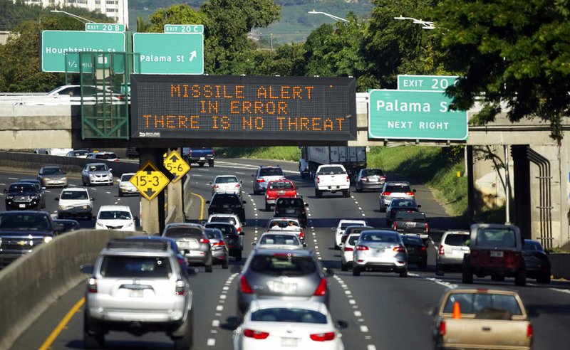 Cory Lum/Civil Beat via AP, File In this Jan. 13, 2018, file photo provided by Civil Beat, cars drive past a highway sign that says "MISSILE ALERT ERROR THERE IS NO THREAT" on the H-1 Freeway in Honolulu. A Hawaii employee who mistakenly sent an alert warning of an incoming ballistic missile earlier this month, creating a panic across the state, thought an actual attack was imminent, the Federal Communications Commission said Tuesday, Jan. 30, 2018.