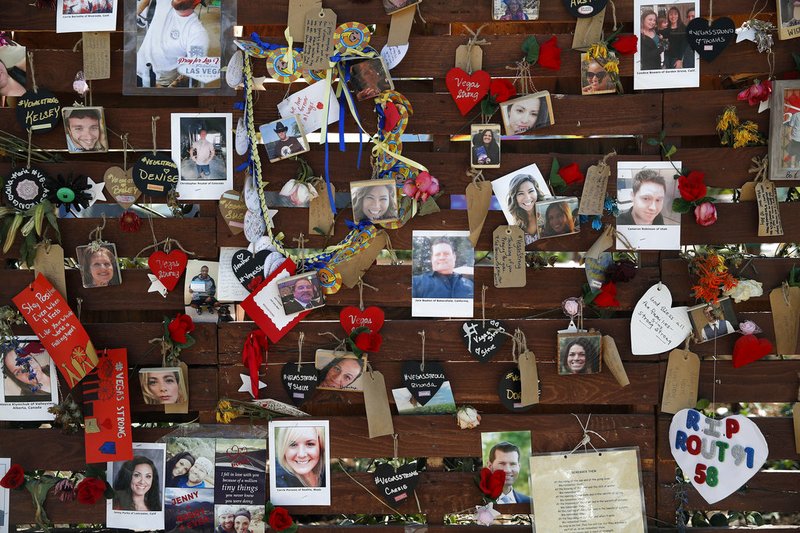 AP File Photo/John Locher In this Oct. 16, 2017, file photo,,photos and notes adorn a wall at the Las Vegas Community Healing Garden in Las Vegas. The garden was built as a memorial for the victims of the recent mass shooting in Las Vegas. Two Nevada judges in Las Vegas have ordered the release of search warrant records and autopsy reports related to the deadliest mass shooting in modern U.S. history, with some information redacted.