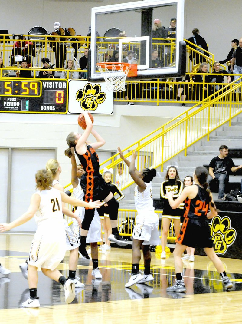 MARK HUMPHREY ENTERPRISE-LEADER/Gravette senior Kirstin Branscum scores the first basket of the game on a drive to the hoop. She had 16 points, but the Lady Lions lost on a last-second basket, 54-52, at Prairie Grove on Jan. 23.