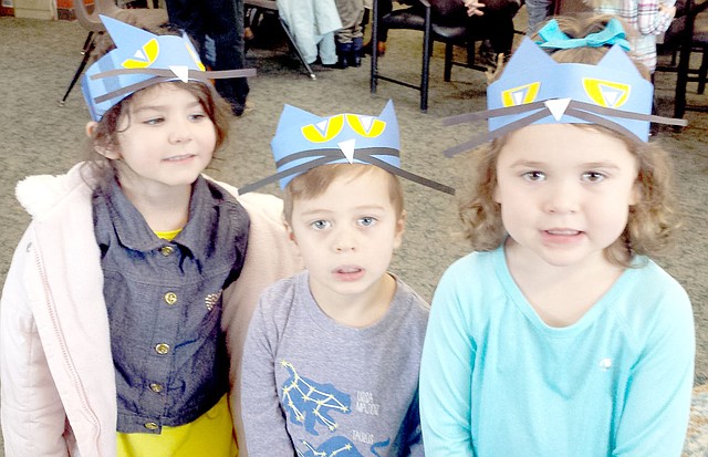 Photo submitted Lily, James and Katie rock their Pete the Cat headbands at story time in the Bella Vista Library.