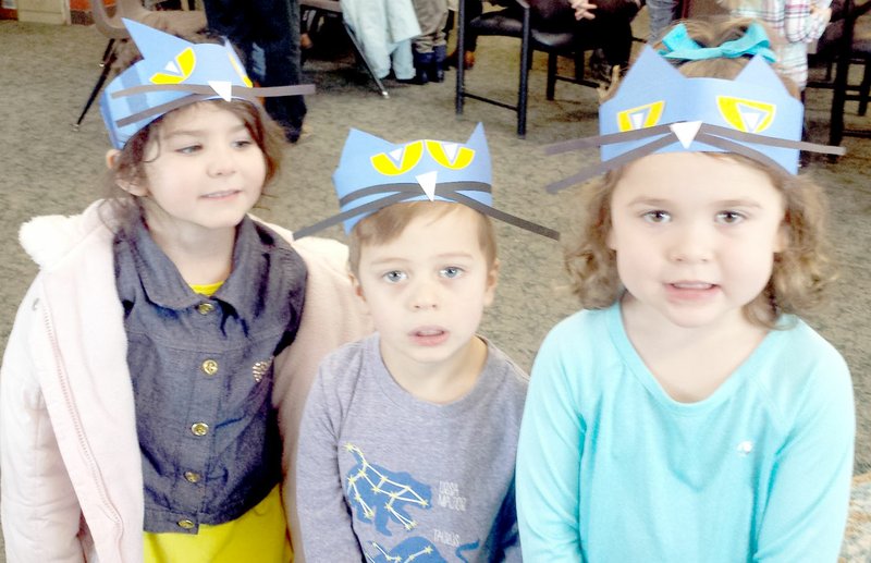 Photo submitted Lily, James and Katie rock their Pete the Cat headbands at story time in the Bella Vista Library.