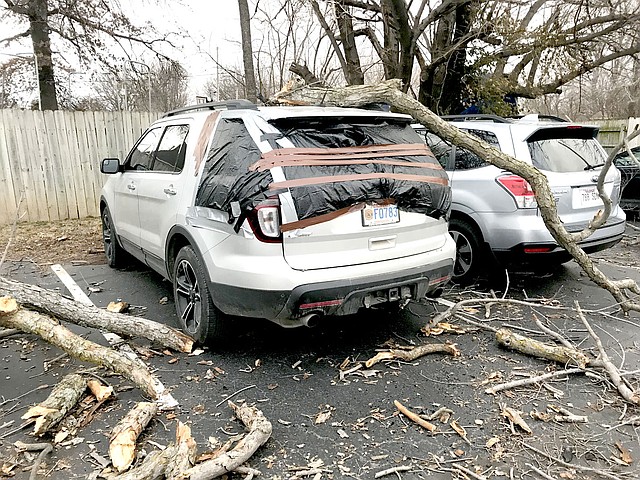 SUBMITTED Three cars were damaged by a falling tree limb at Gentry Family Dentistry on Jan. 22. No injuries were reported.