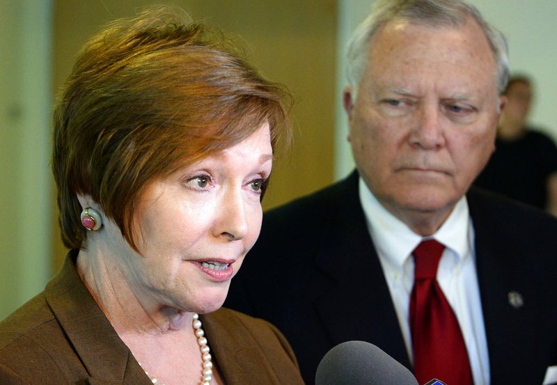 FILE - In this Oct. 16, 2014 file photo, Brenda Fitzgerald, Georgia Department of Public Health commissioner, left, and Georgia Gov. Nathan Deal respond to questions in Atlanta. U.S. officials announced that Fitzgerald, the director of the nation&#x2019;s top public health agency has resigned because of financial conflicts of interest. On Tuesday, Jan. 30, 2018, the U.S. Department of Health and Human Services officials said Fitzgerald&#x2019;s complex financial interests had caused conflicts of interest that made it difficult to do her job. Alex Azar, who was sworn in as head of the department Monday, accepted her resignation. (AP Photo/David Tulis, File)